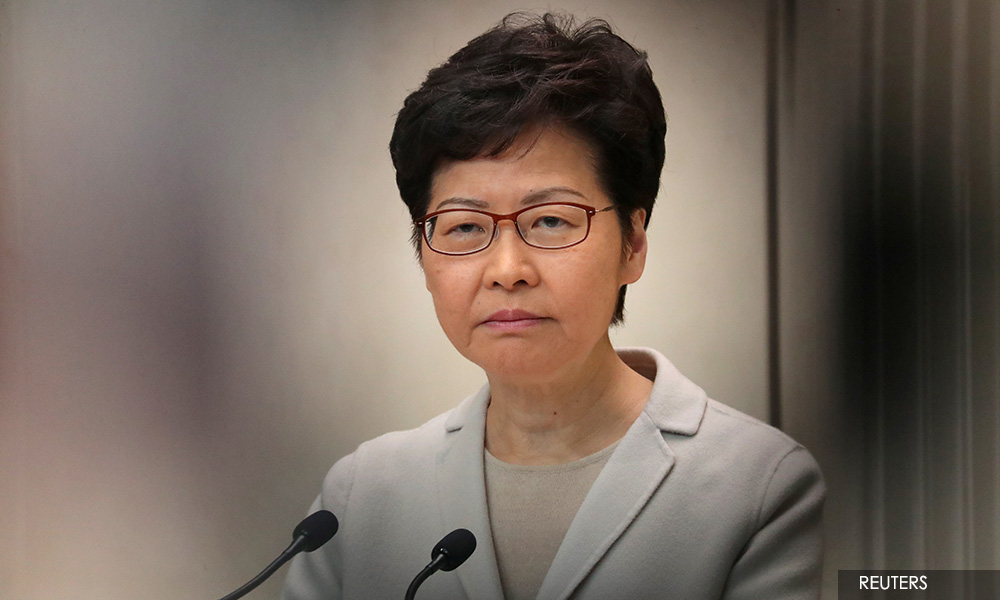 Hong Kong reshuffles gov't as debate rages over Beijing's role