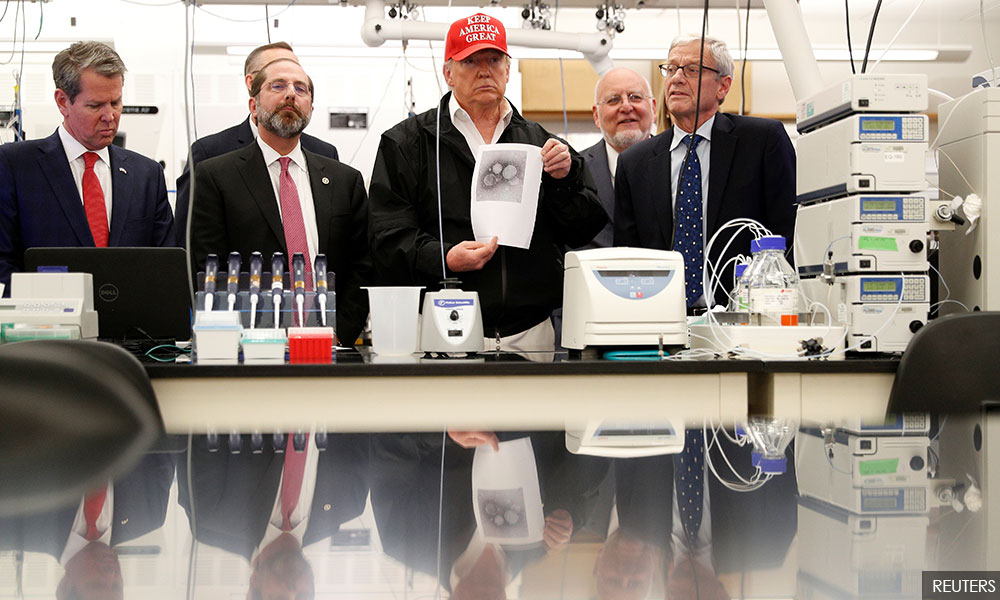 Trump says he will invoke wartime act to fight 'enemy' coronavirus