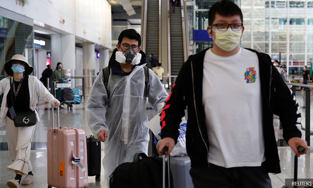 China's imported coronavirus cases jump as students, expats flock home