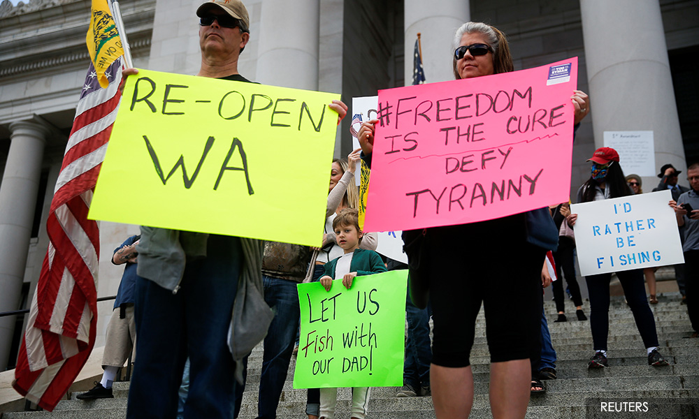 As protesters decry US coronavirus lockdown, officials urge caution