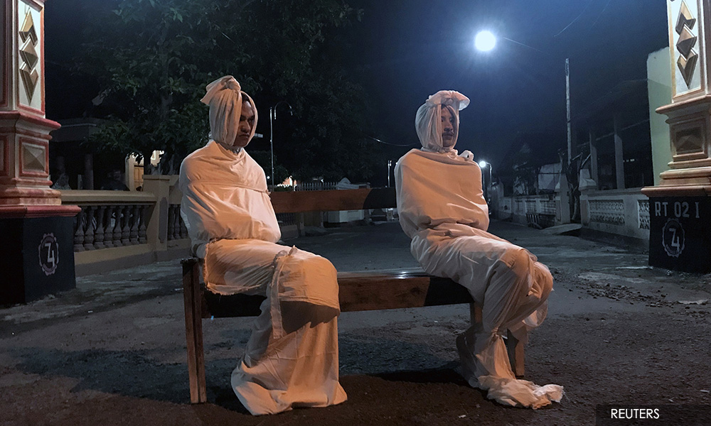 'Ghosts' scare Indonesians indoors and away from coronavirus