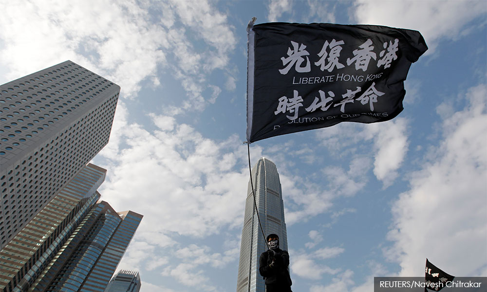 Hong Kong police detain veteran democracy activists in raids