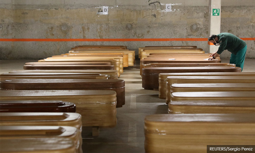 Spain's coronavirus deaths pass 14,500, but real toll may be bigger