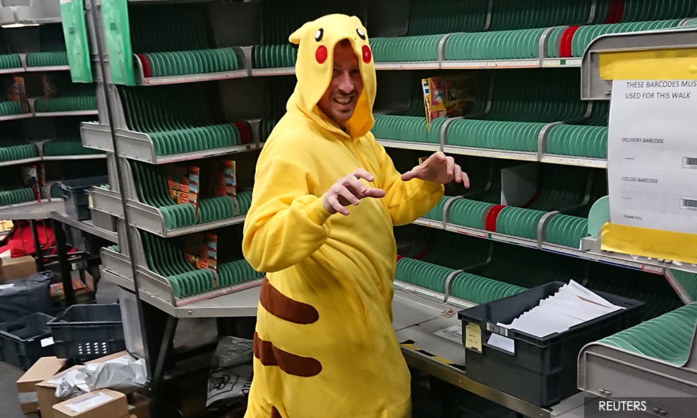 British postman delivers fancy dress joy to isolating residents