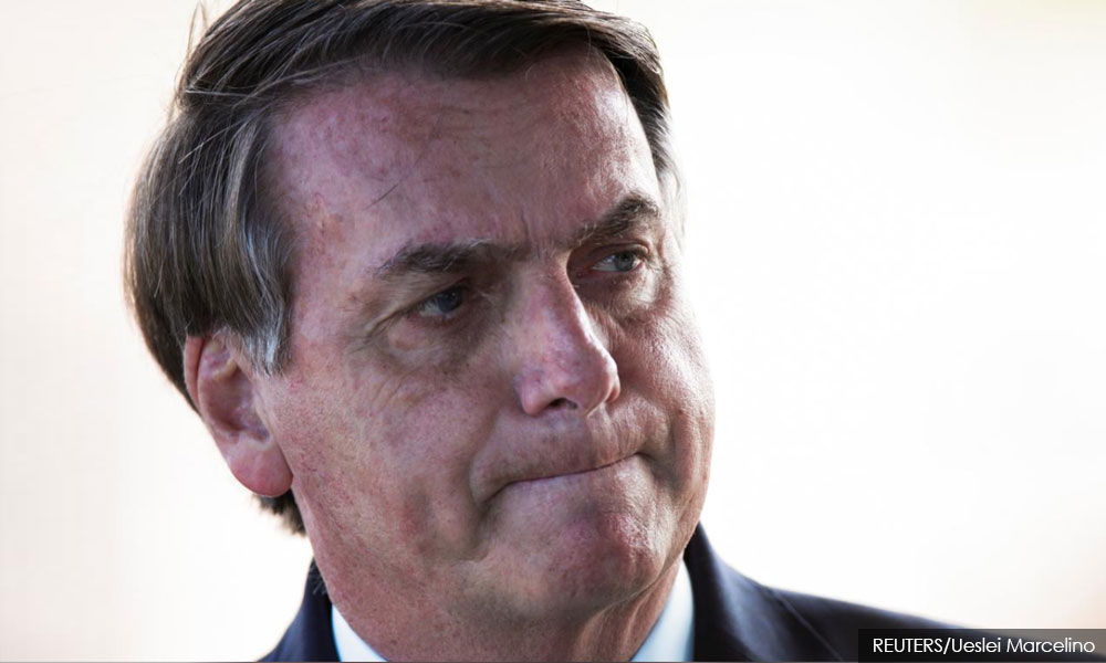 Brazil's Bolsonaro isolated, weakened by coronavirus denial