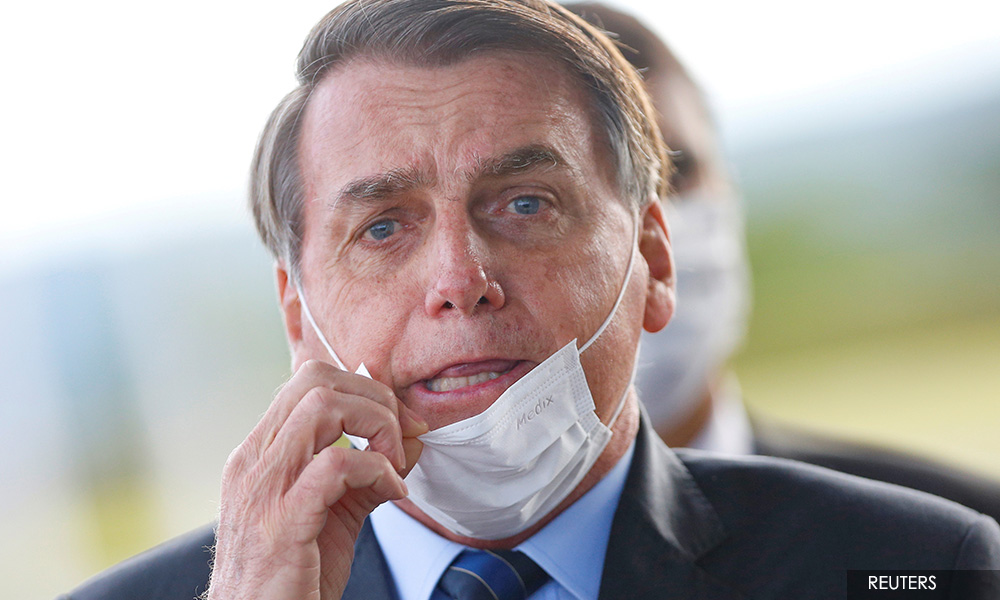 Brazil's Bolsonaro says will return to work if new test shows he is Covid-19 free
