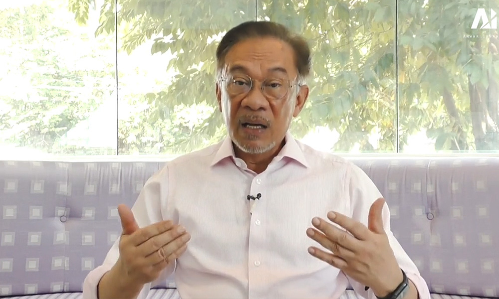 Anwar explains absence from presser, likens Riza's case to chicken theft