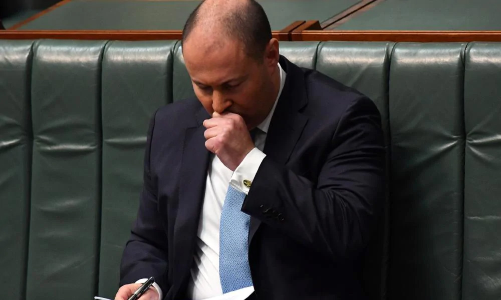 Australian Treasurer tested for Covid-19 after coughing in Parliament
