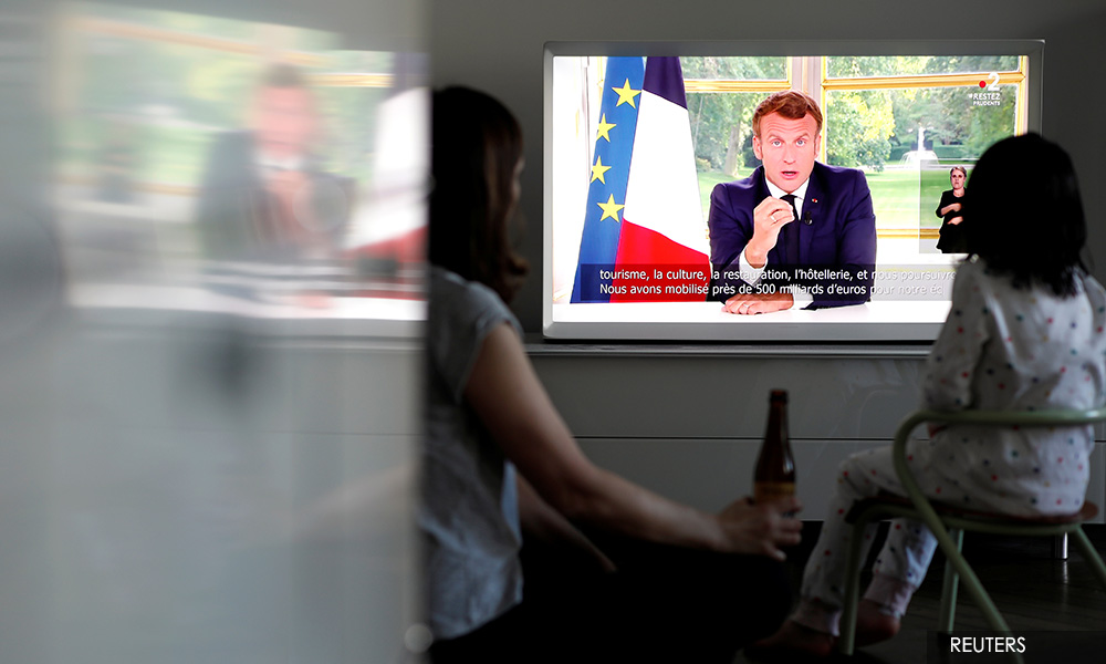 Macron says France won't remove statues, erase history