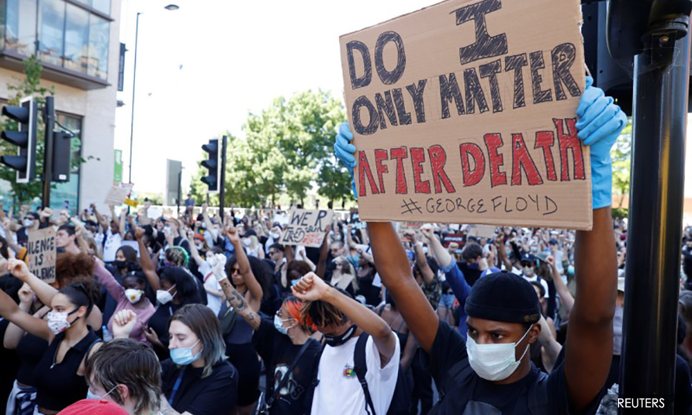 Hundreds of protesters rally in London, Berlin over US death
