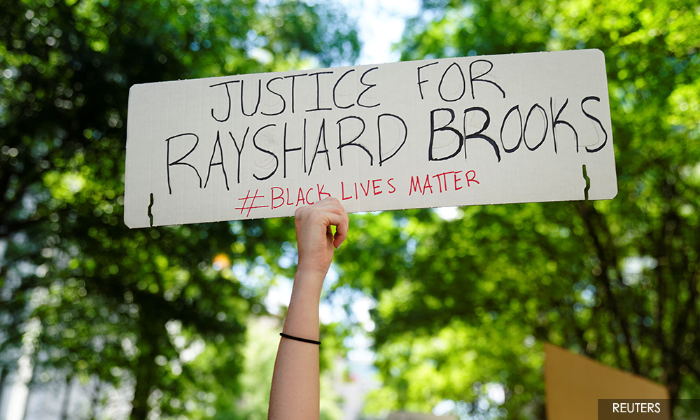 Protesters burn down restaurant in Atlanta where black man was slain