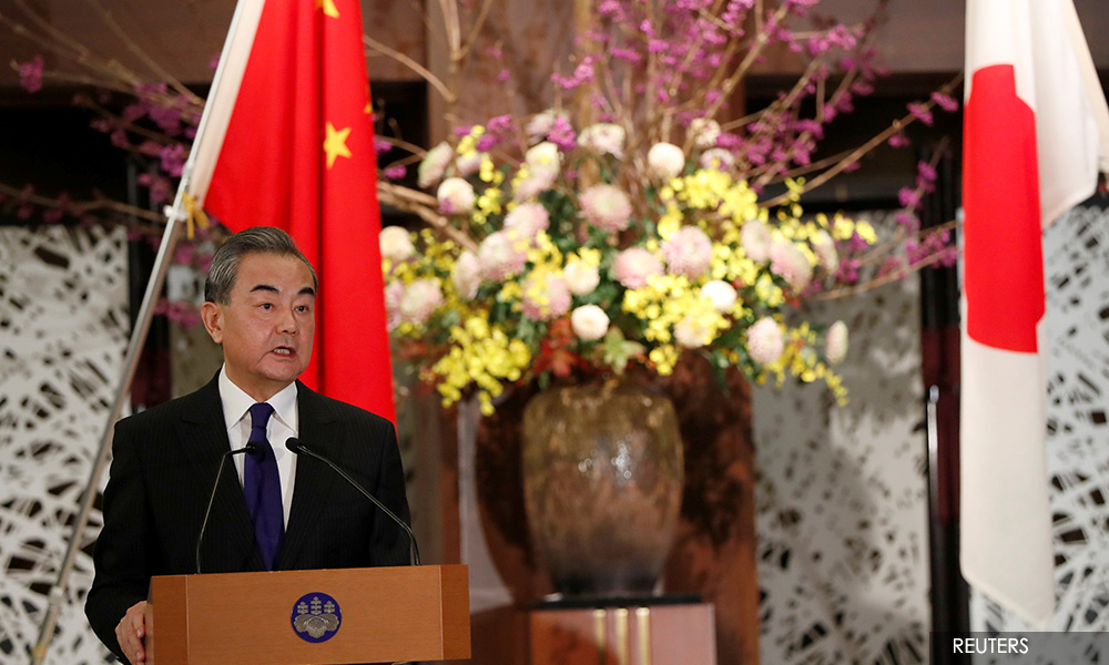 China minister to meet Suga, first high-level contact with Japan's new PM