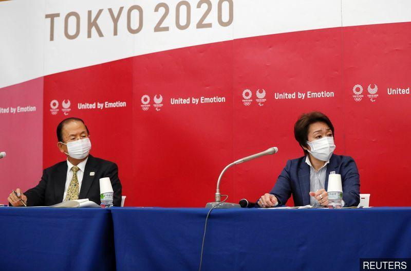 Olympics-Tokyo 2020 organisers ban alcohol, defend allowing spectators
