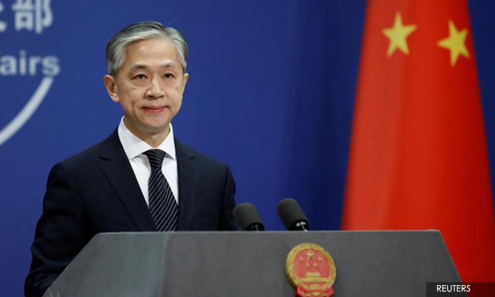 China tells US to stop 'slander' on Covid-19 origin