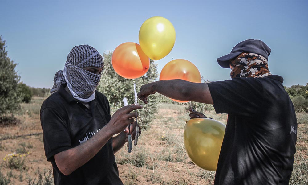 Israel bombs Hamas sites in Gaza over fire balloons - military