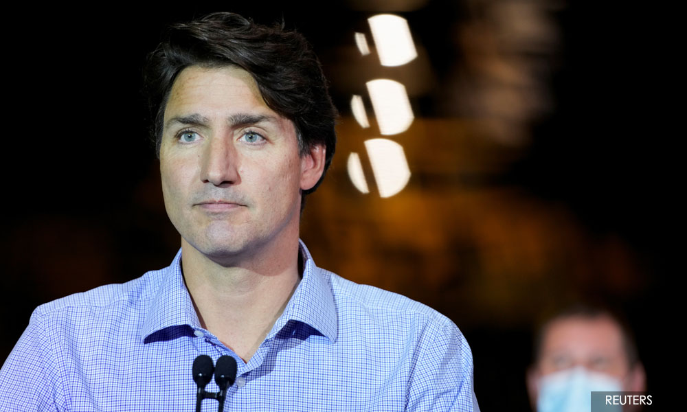 Trailing in polls, Trudeau goes on attack two weeks before Canada votes