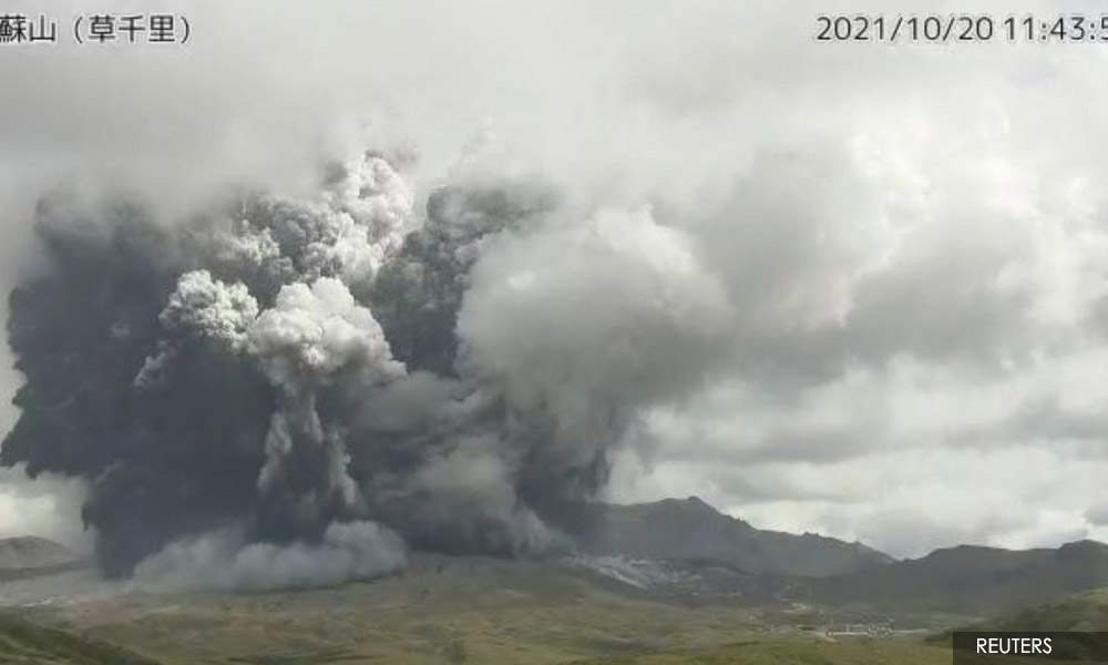 Japanese volcano spews plumes of ash, people warned away
