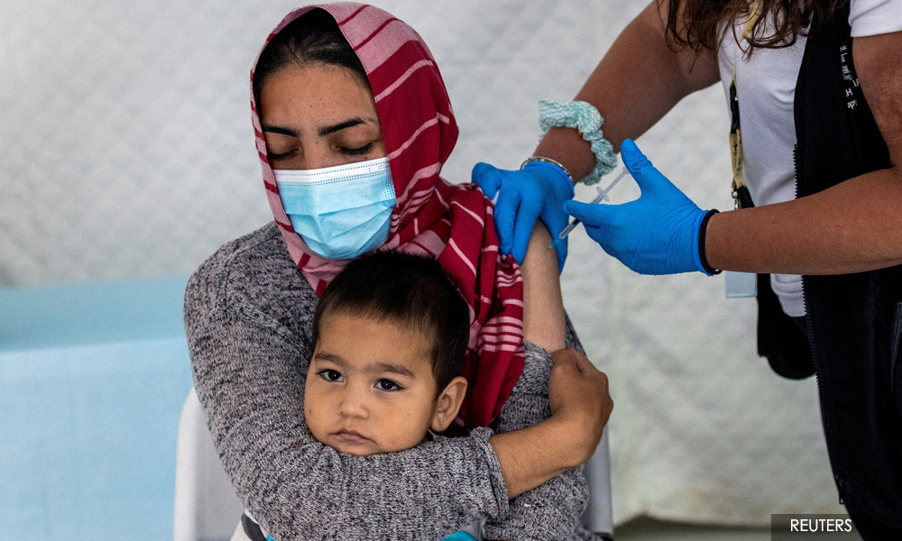 Refugees lack Covid shots because drugmakers fear lawsuits - documents