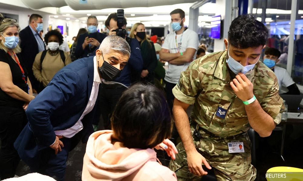 Omicron coronavirus cases surge in UK, scientists see bigger wave