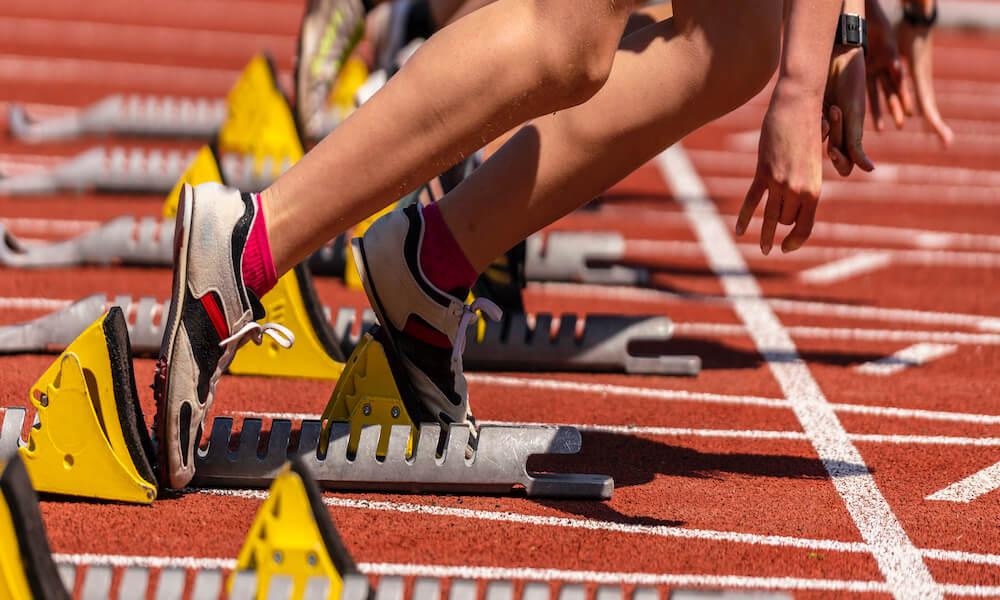 PM urged to reverse funding cuts for athletes