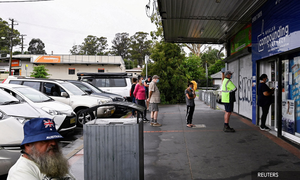 Australia swamped by Omicron surge as pressure grows on hospitals