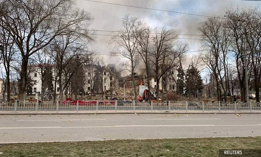 Shells hit theatre sheltering Ukraine civilians, Biden calls Putin a war criminal