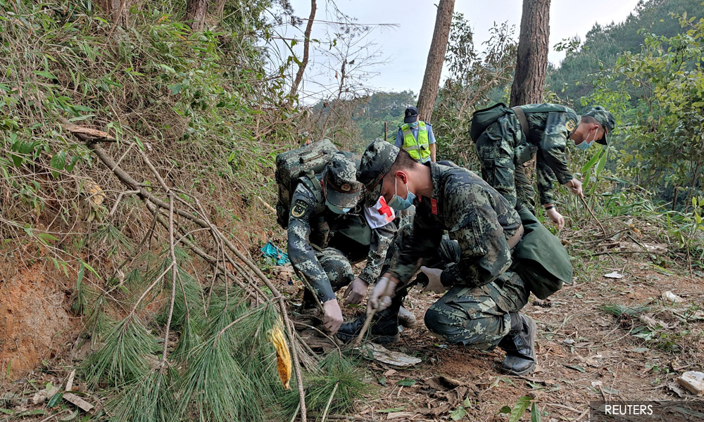 China searches for survivors from plane crash with cause still unclear