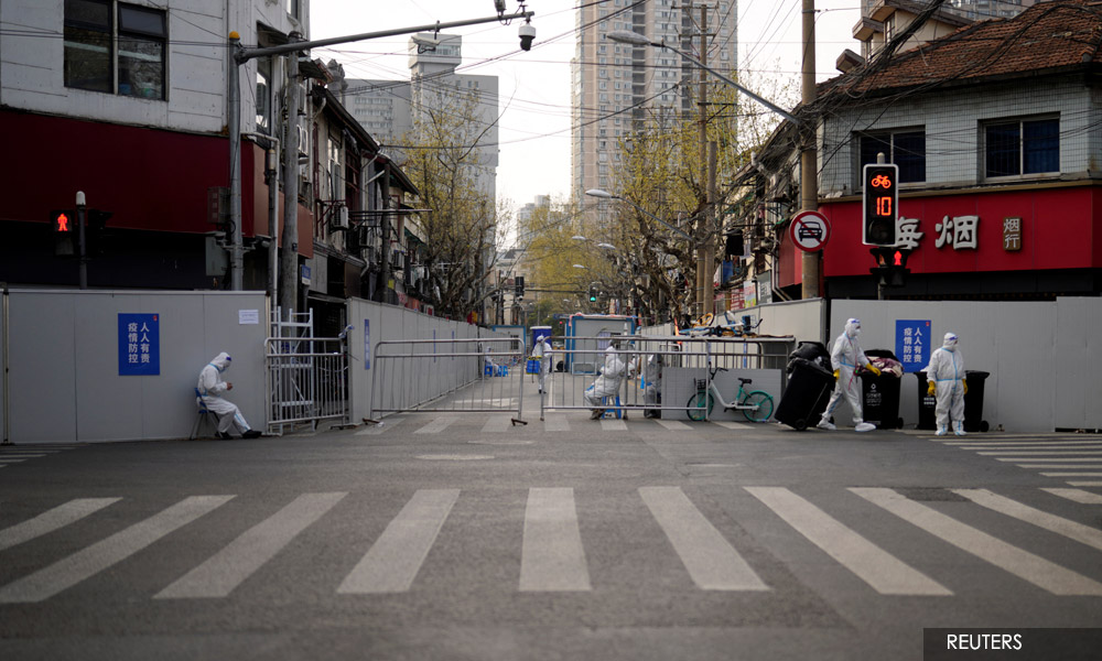 Shanghai expands Covid lockdown as new daily cases surge by a third