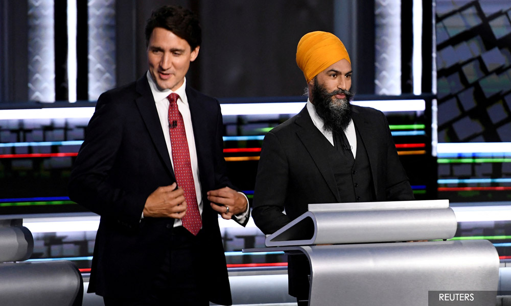 Canada's Trudeau strikes surprise deal to keep power until 2025