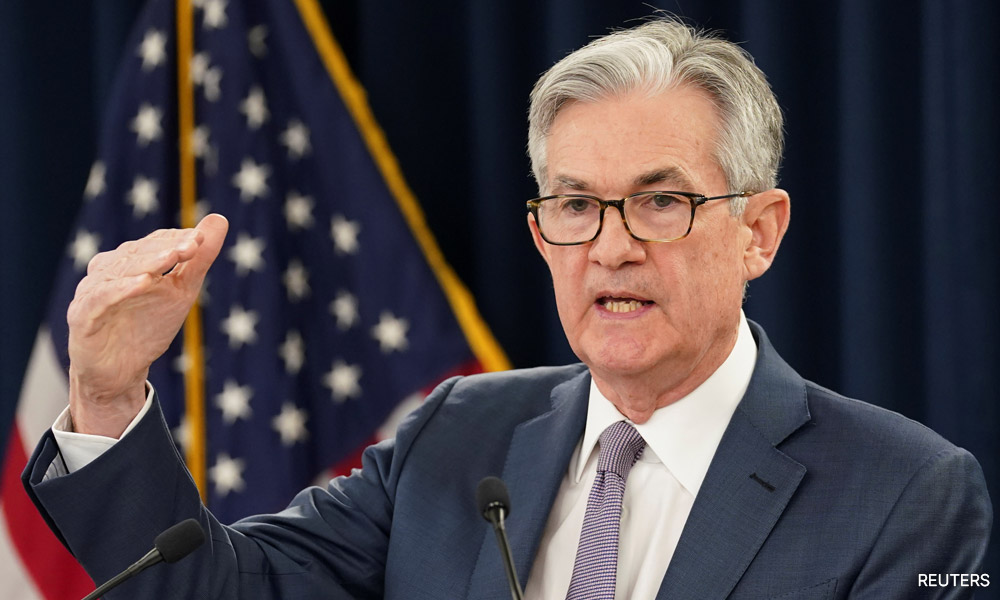 Shares slip, dollar steady as markets assess Powell comments