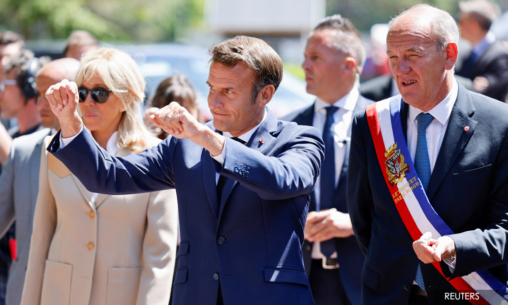 Macron faces tough battle for control of parliament after first round vote