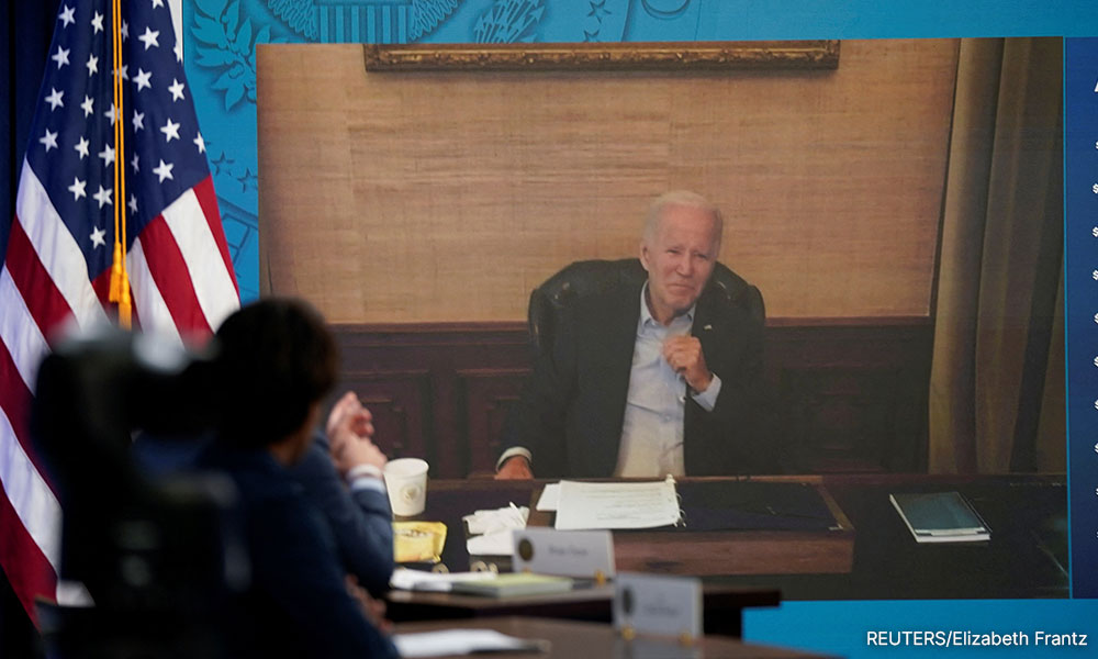 Vigorous but coughing, Covid-hit Biden appears virtually at White House meeting