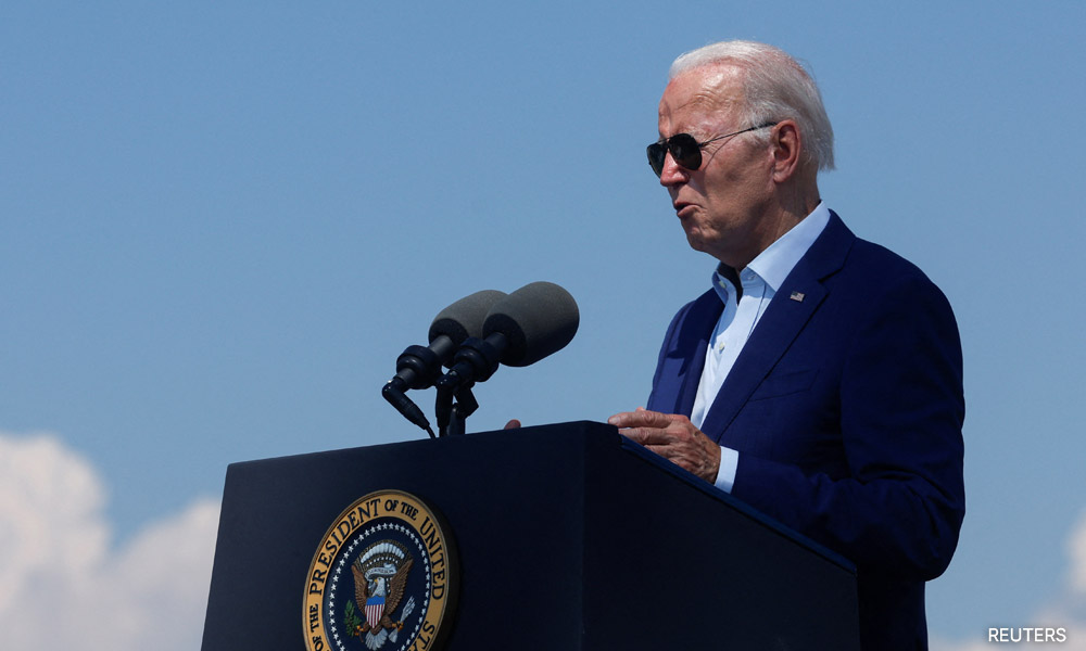 Biden stops short of declaring climate emergency, takes steps on wind power