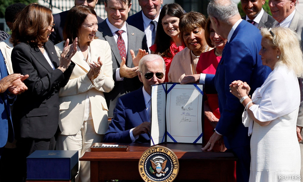 Biden signs US$52.7b bill to boost US chips, compete with China