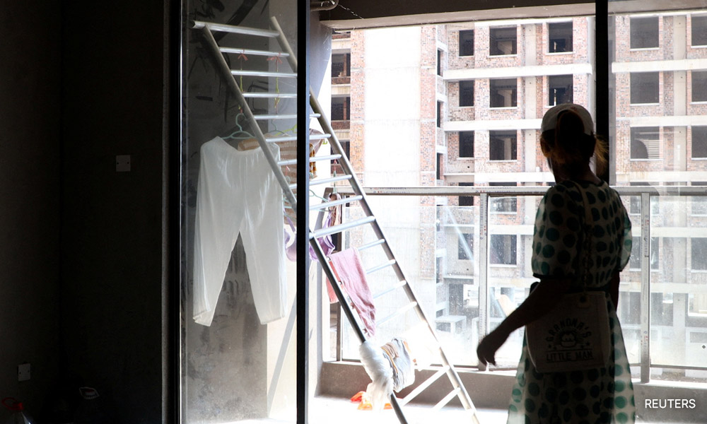 In China, home buyers occupy their 'rotting', unfinished properties