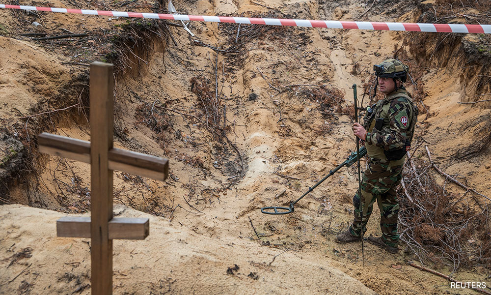 Ukraine says some bodies found in mass burial site had been bound