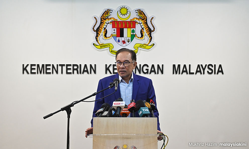 Anwar clocks in as finance minister