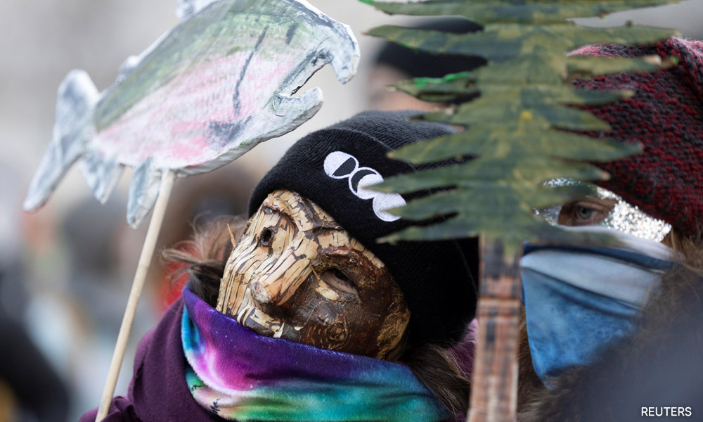 Activists dressed as birds and trees rally for nature at COP15 in Montreal