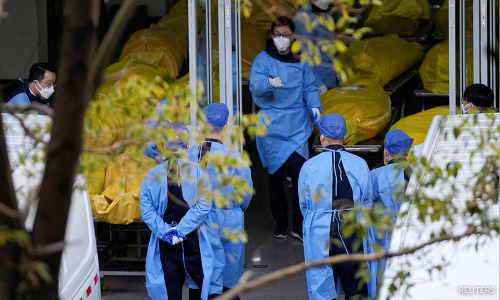 China reports huge rise in Covid-related deaths after data criticism
