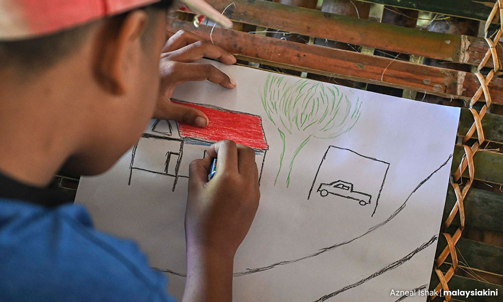 A child living in Kampung Sudak draws up what his dream home would look like.