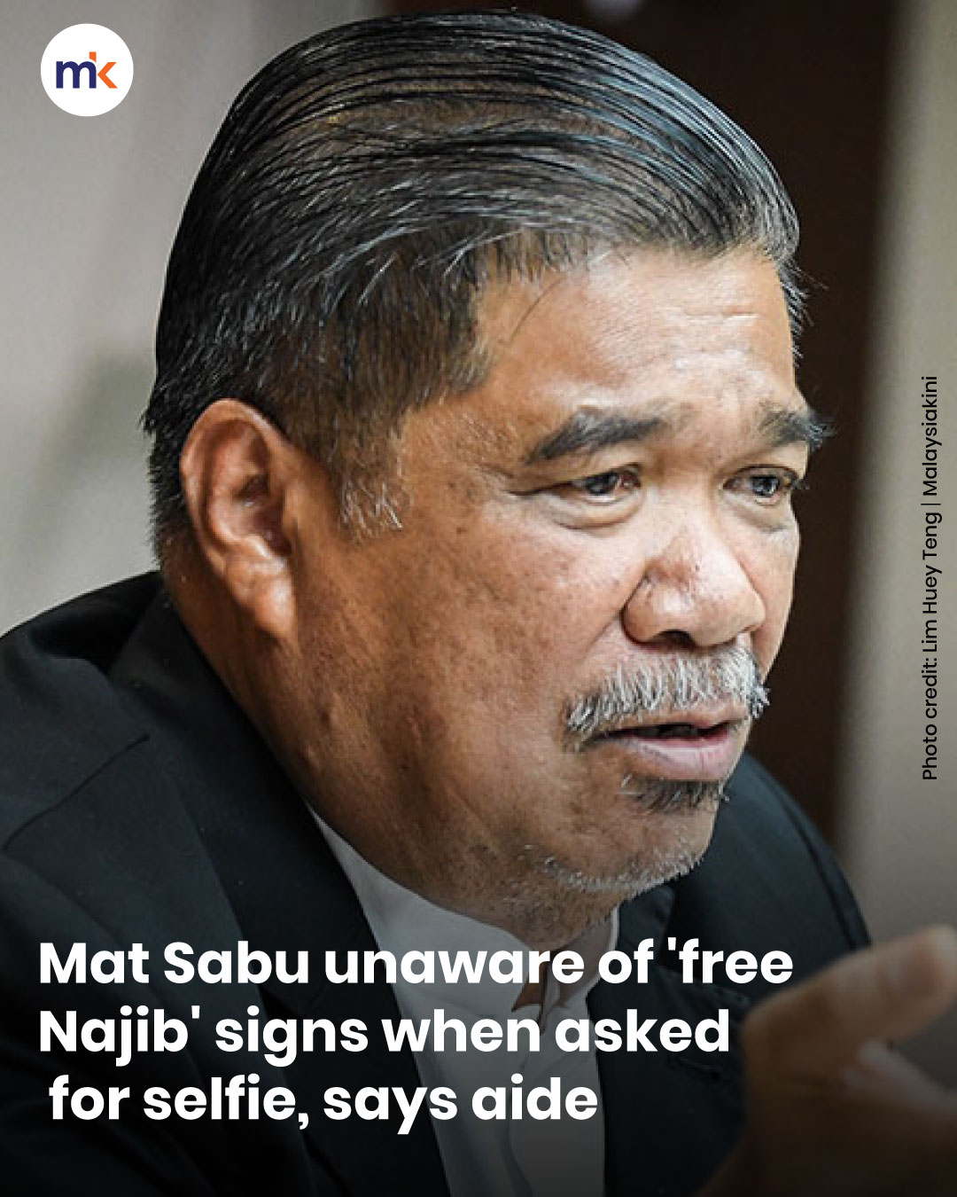 Mat Sabu unaware of 'free Najib' signs when asked for selfie, says aide