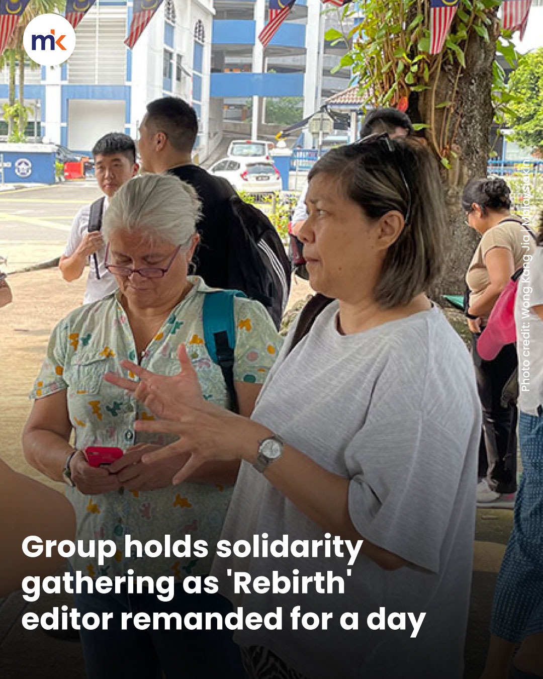 Group holds solidarity gathering as 'Rebirth' editor remanded for a day