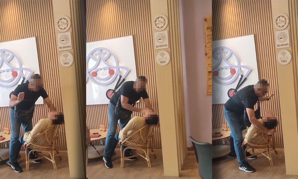 Johor police probing clip of 'cop' raining slaps on man