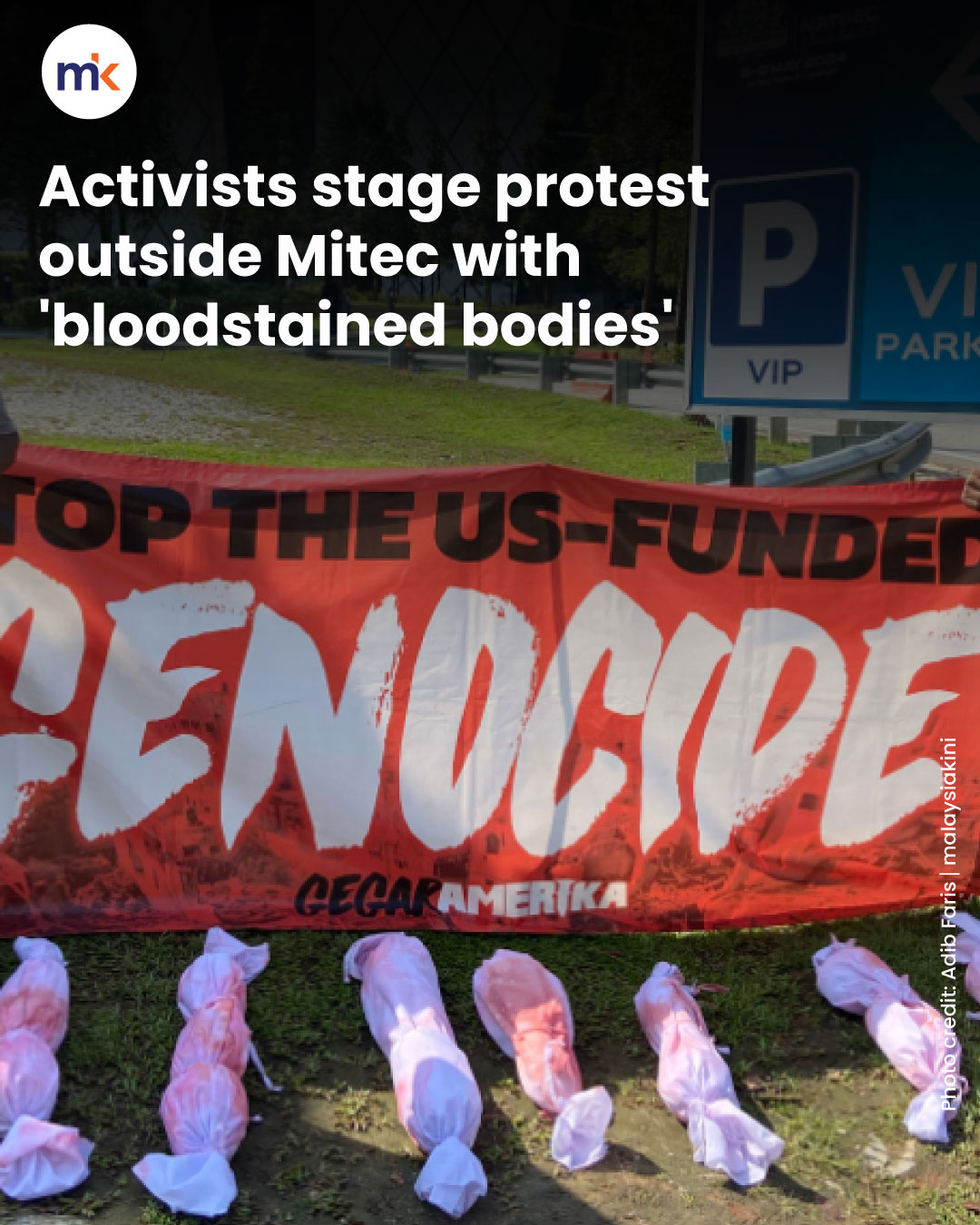 Activists stage protest outside Mitec with 'bloodstained bodies'
