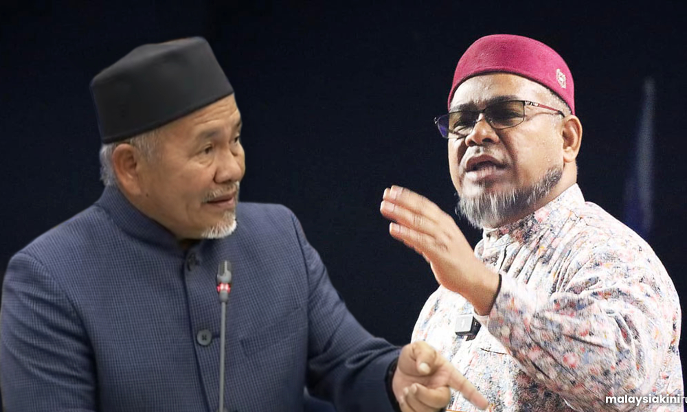 PAS, Umno clerics dispatch 'angels' to clash over Anwar's pay cheque