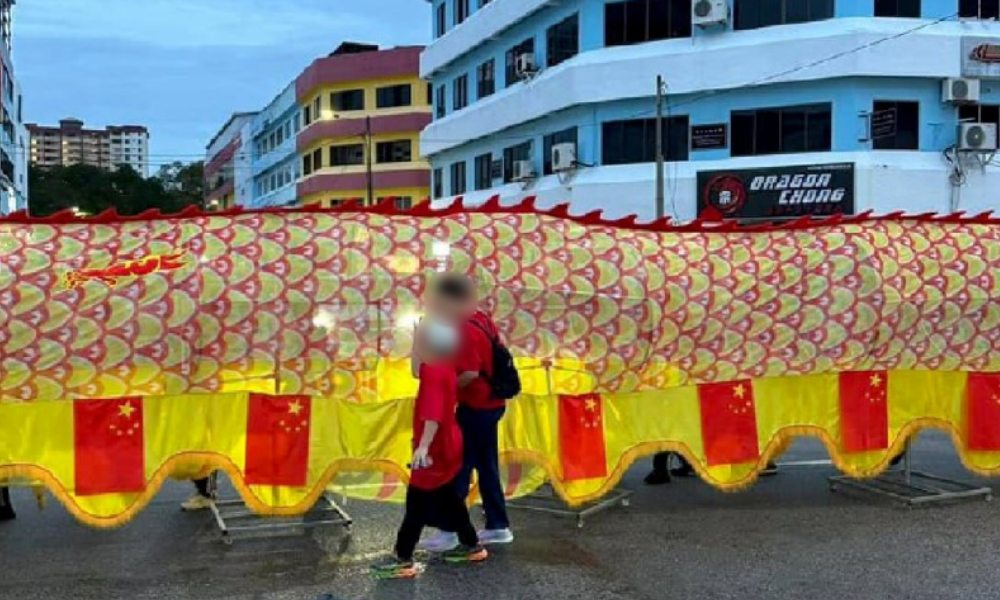Cops probing Muar parade featuring China flags on dragon replica