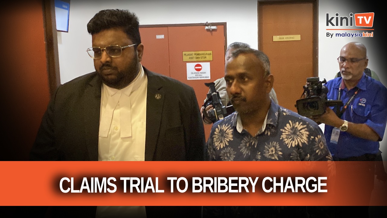 Malaysiakini reporter claims trial to bribery charge