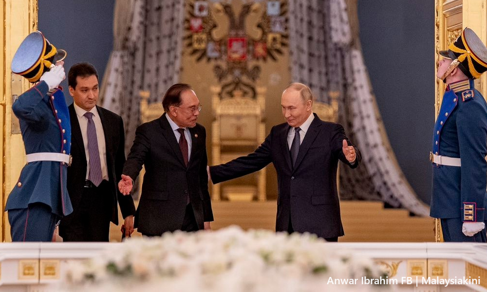 Putin quips Anwar 'true Muslim' after PM cracks second wife joke