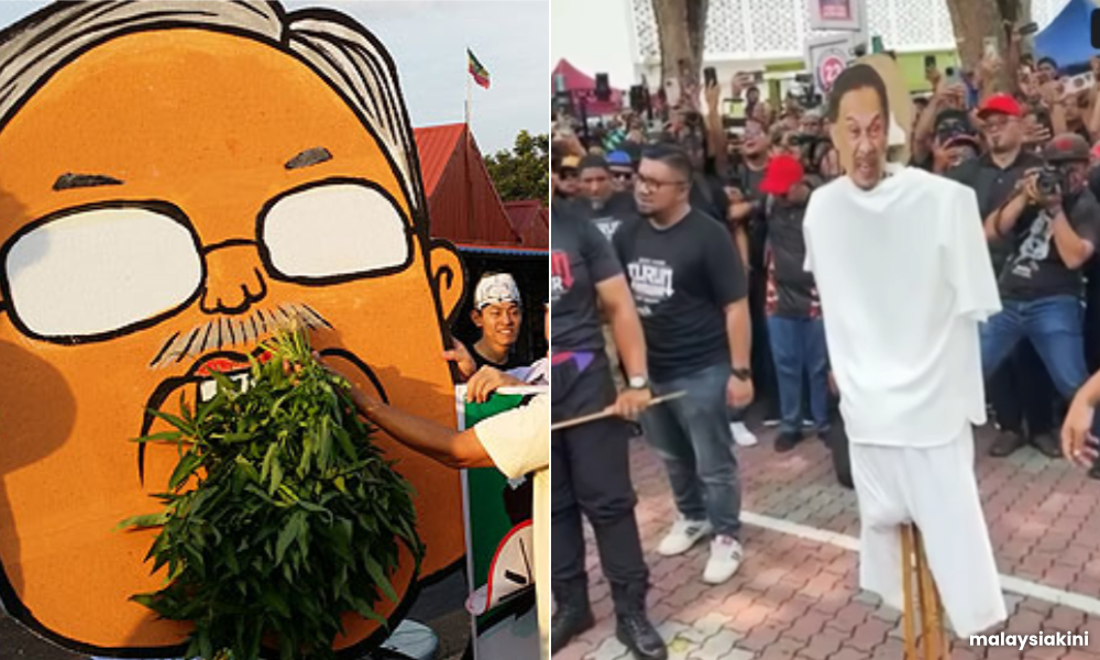 As cops nab Anwar effigy caners, Najib's 'kangkung in mouth' recalled