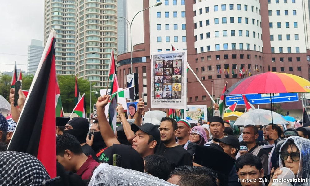 Anti-Israel rally marches in KL rain, leaders want Trump invitation revoked